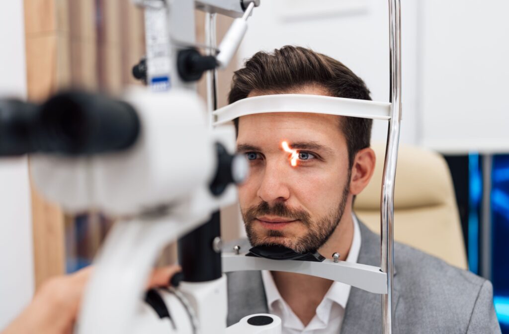 A person has their eye examined with a slit lamp during an eye exam.