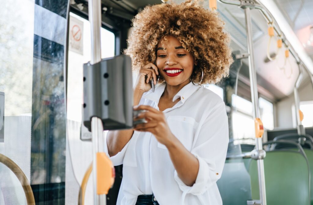 Person riding public transportation instead of driving a car as an alternative for someone with cataracts